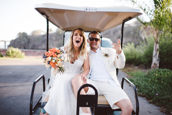 Wedding couple in golf cart 